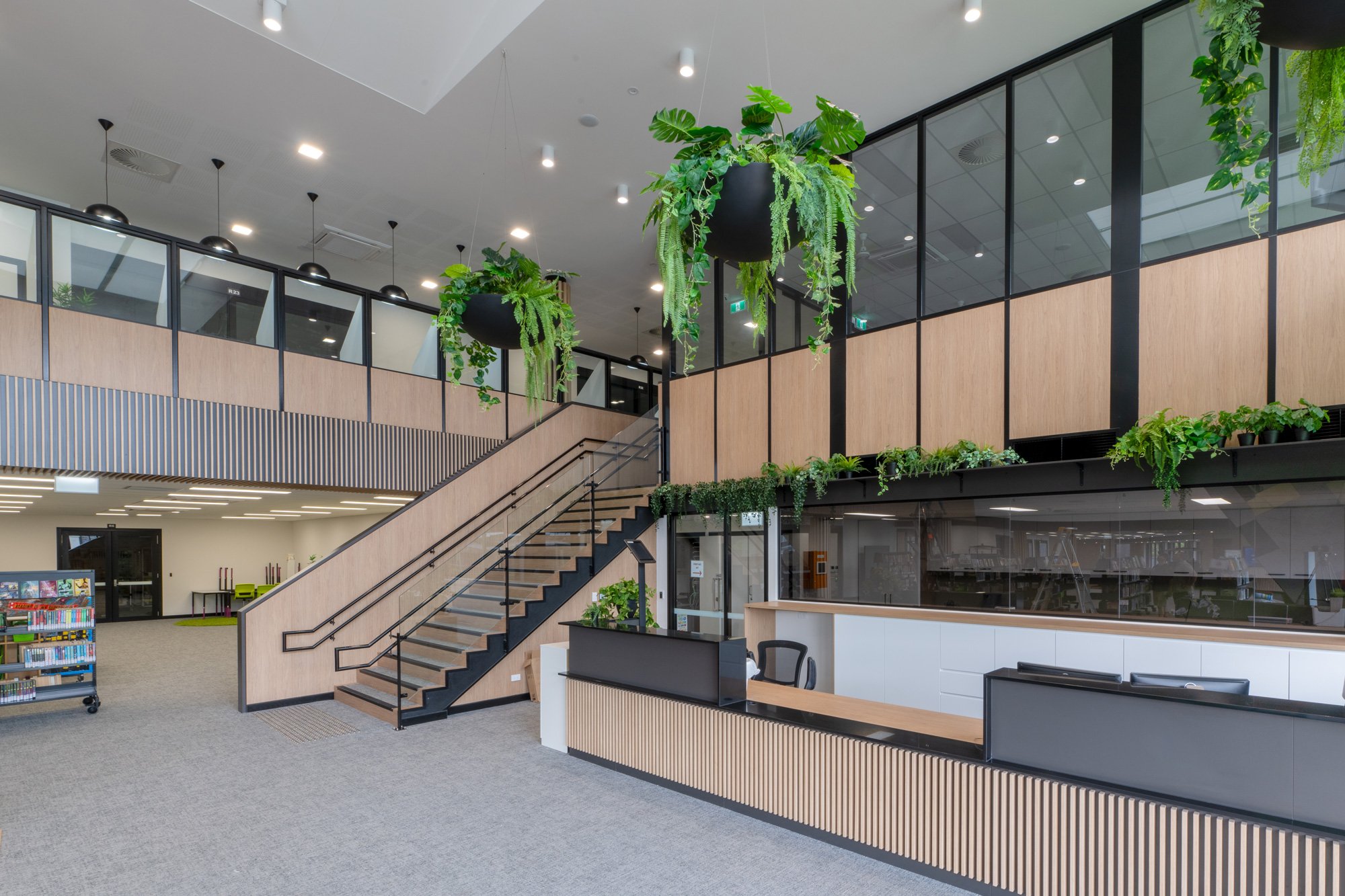 Library atrium with feature stair, planting and multi-level glazing