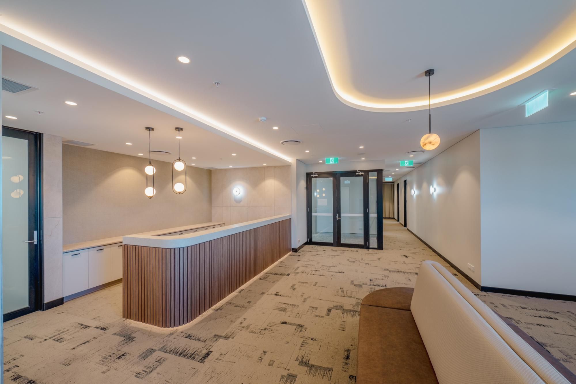 Healthcare facility reception with feature pendant lighting