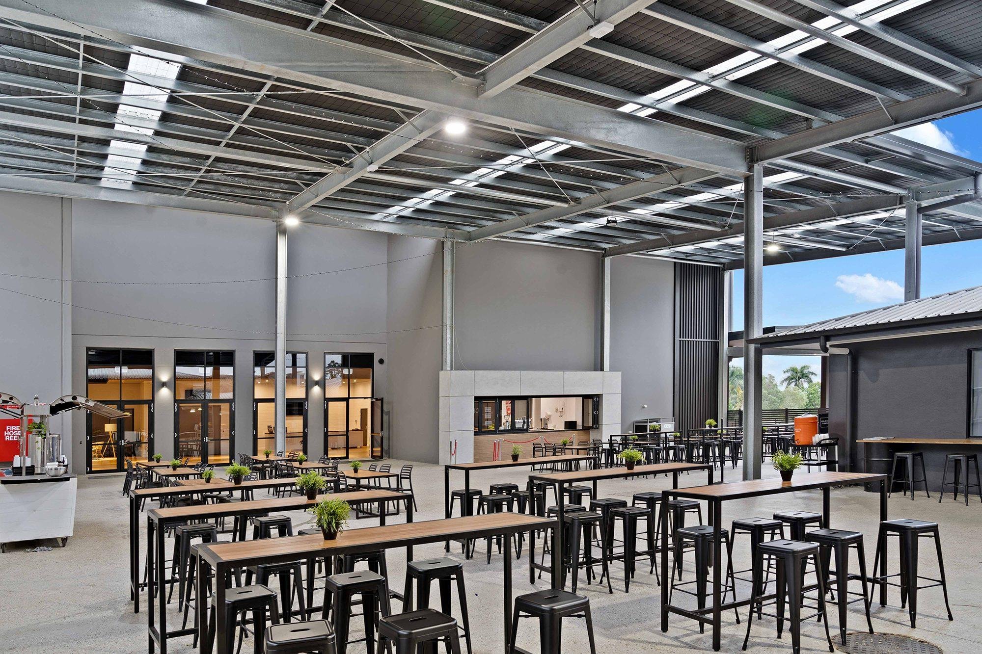 Community hall with high bay lighting and open seating