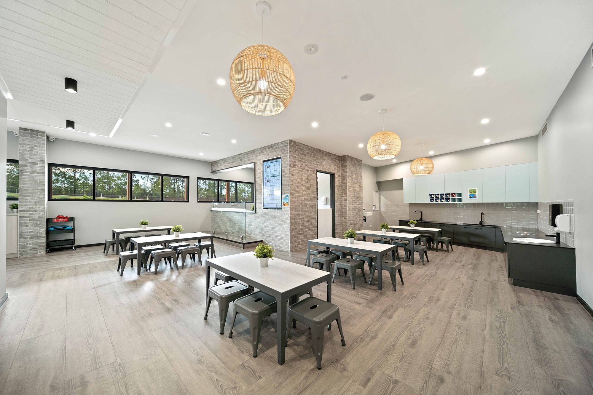 Multi-purpose hall with tables and ceiling services