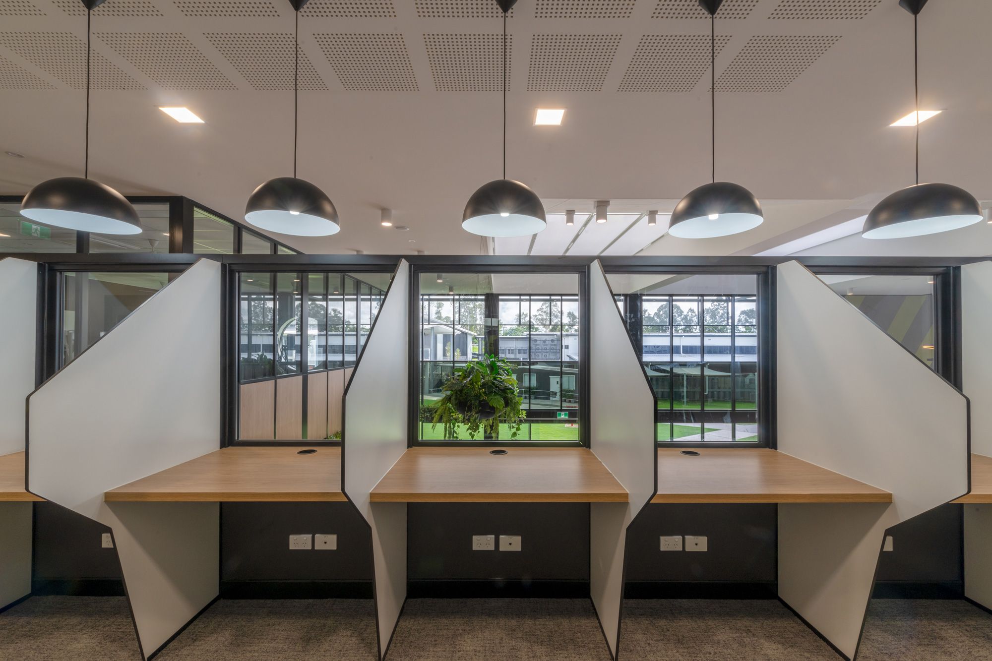 Library study pods with power and data outlets at every desk