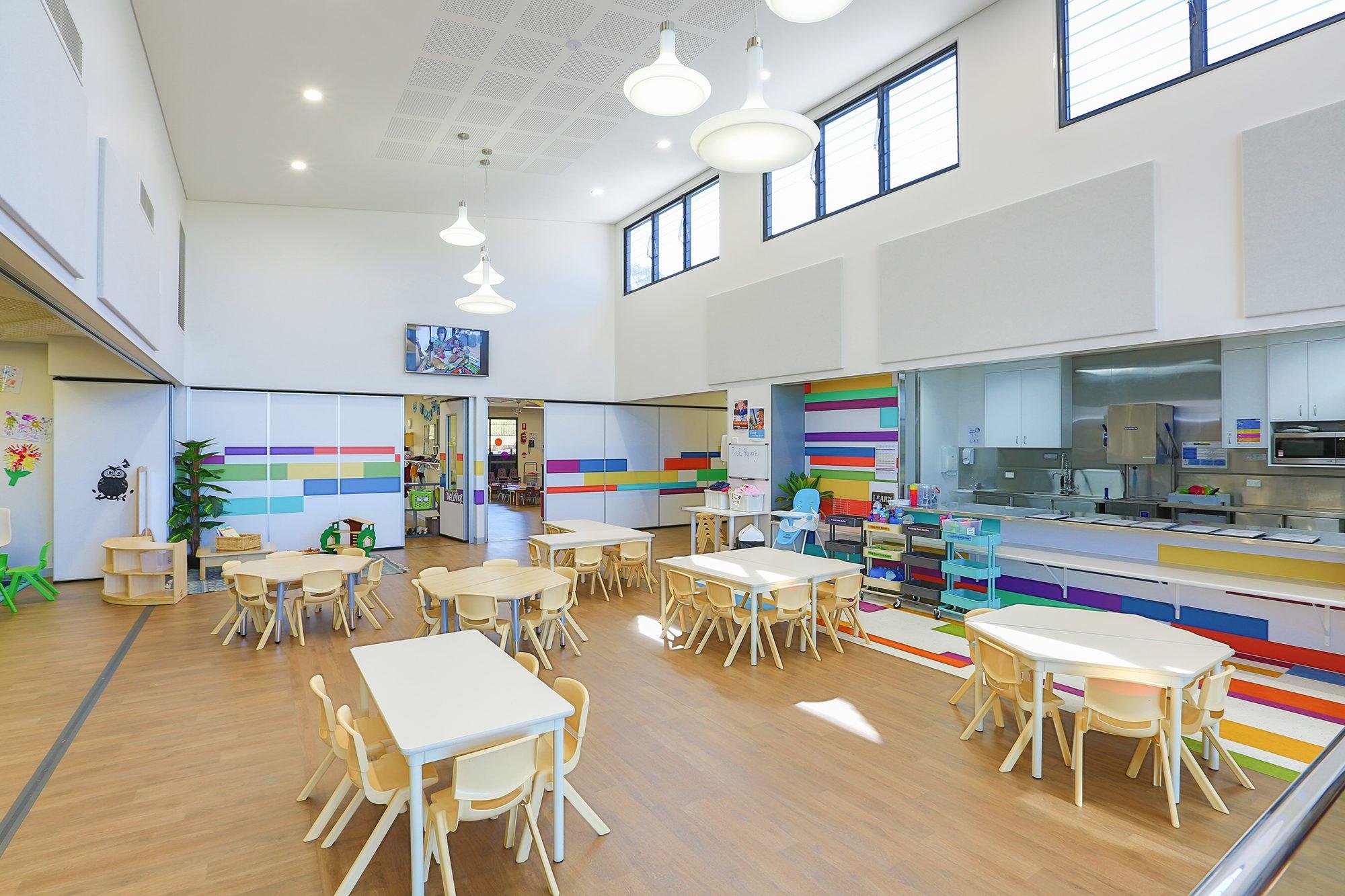 Classroom with colour-blocked joinery and glazing