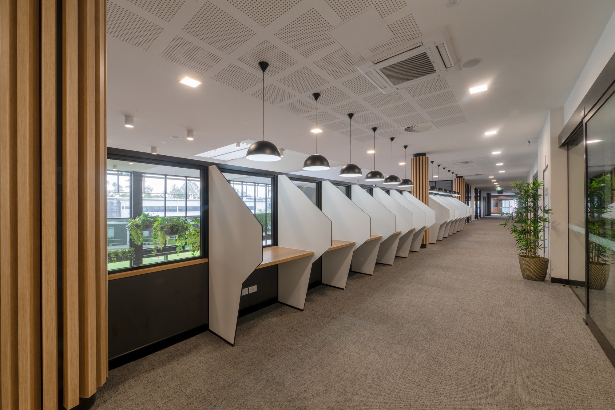 Corridor with pendant lighting and timber lining