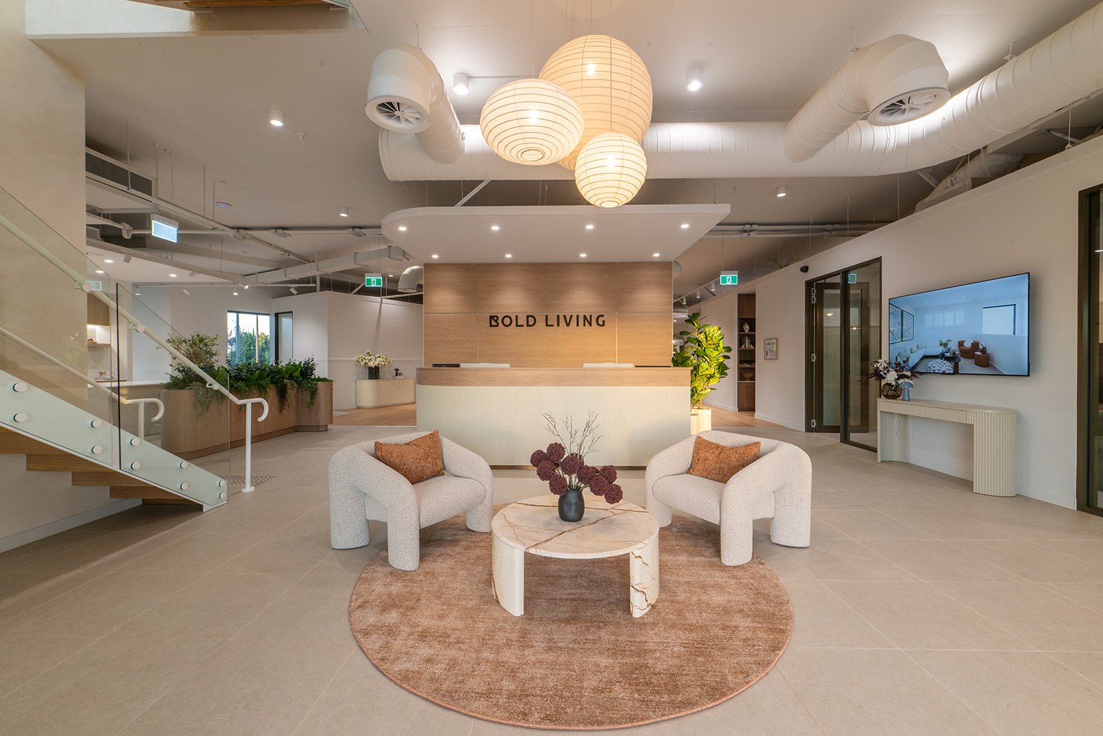 Reception with feature pendant lighting and curved joinery