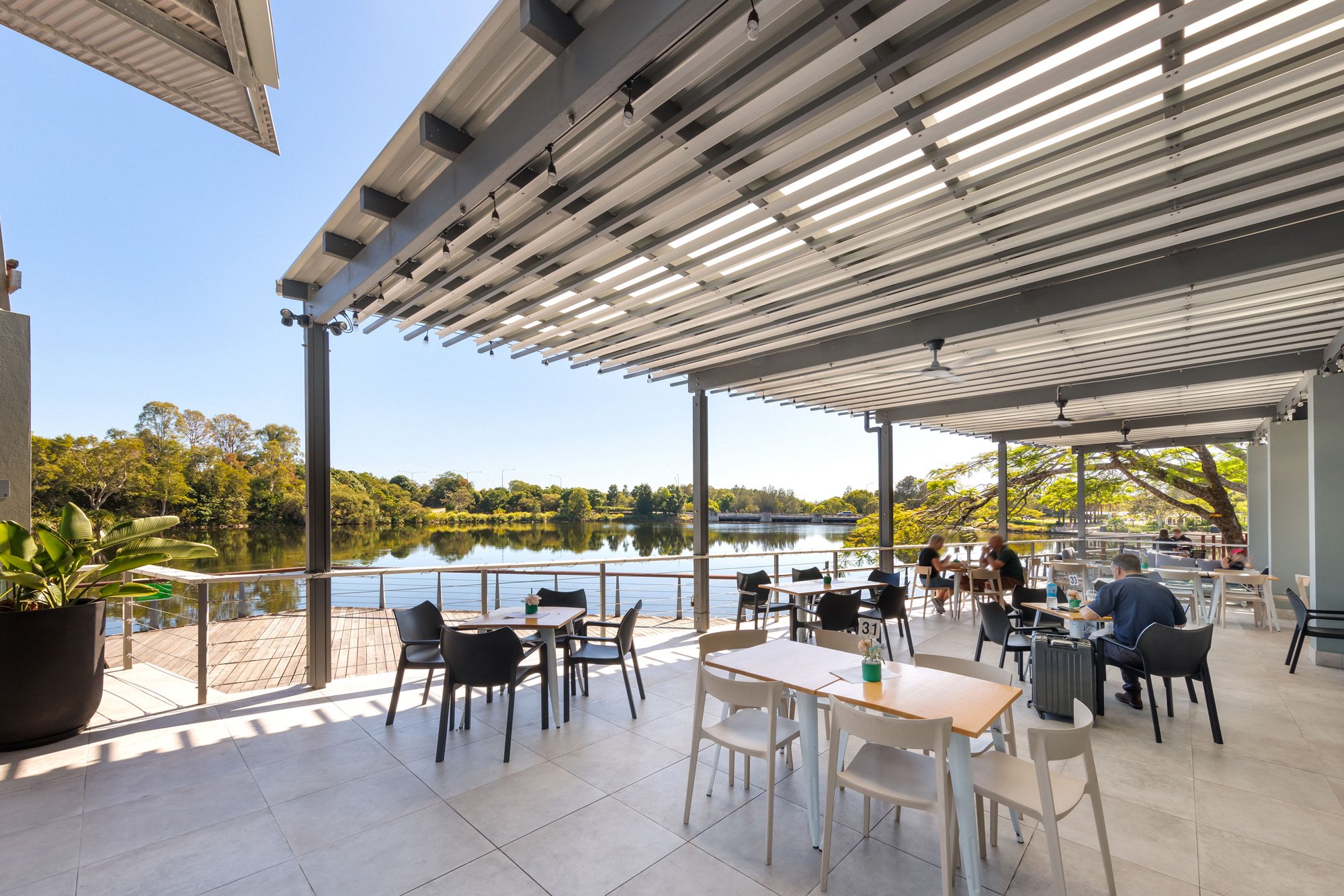 Waterside seating with timber decking and shade structure