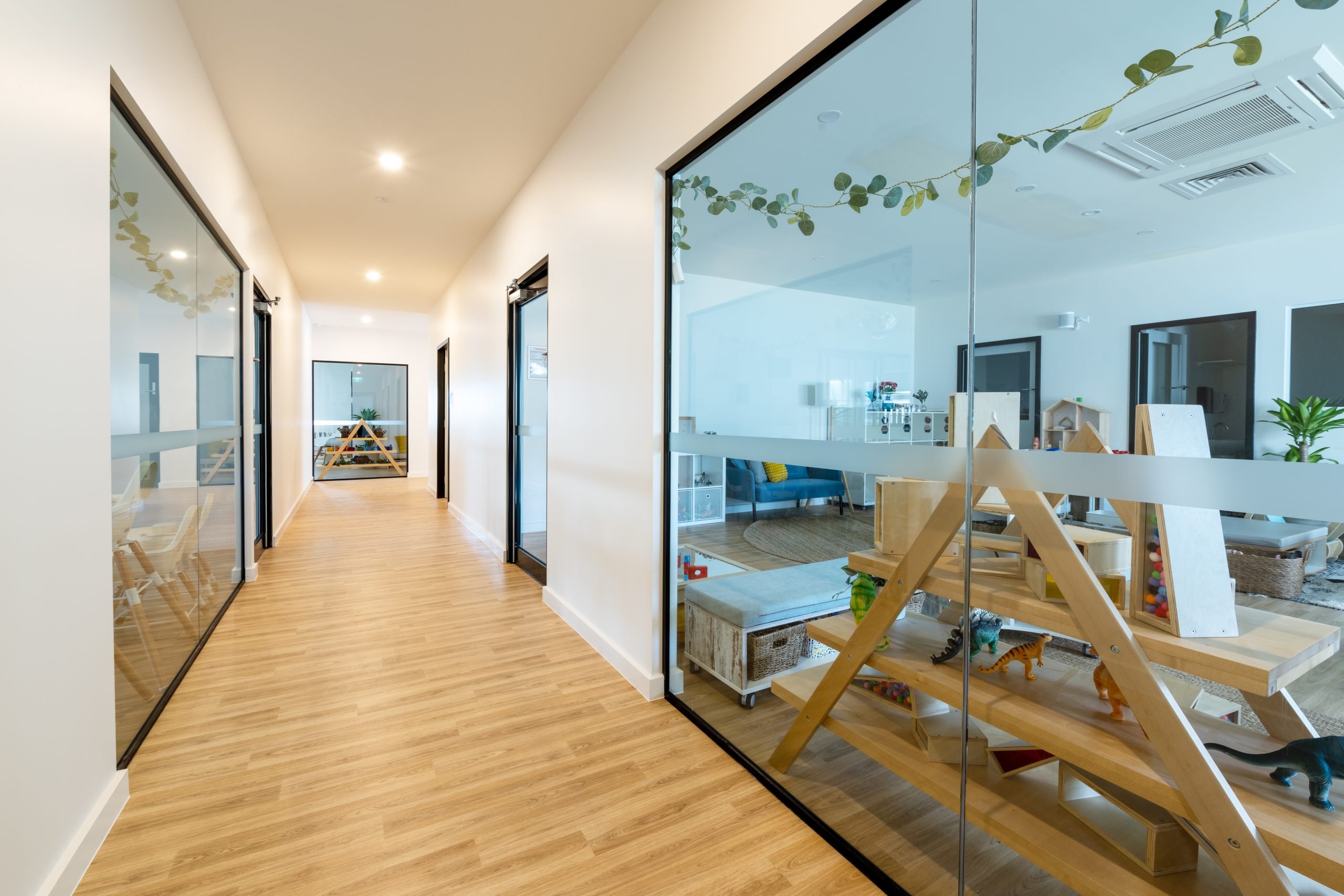 Internal corridor with glazing and timber flooring
