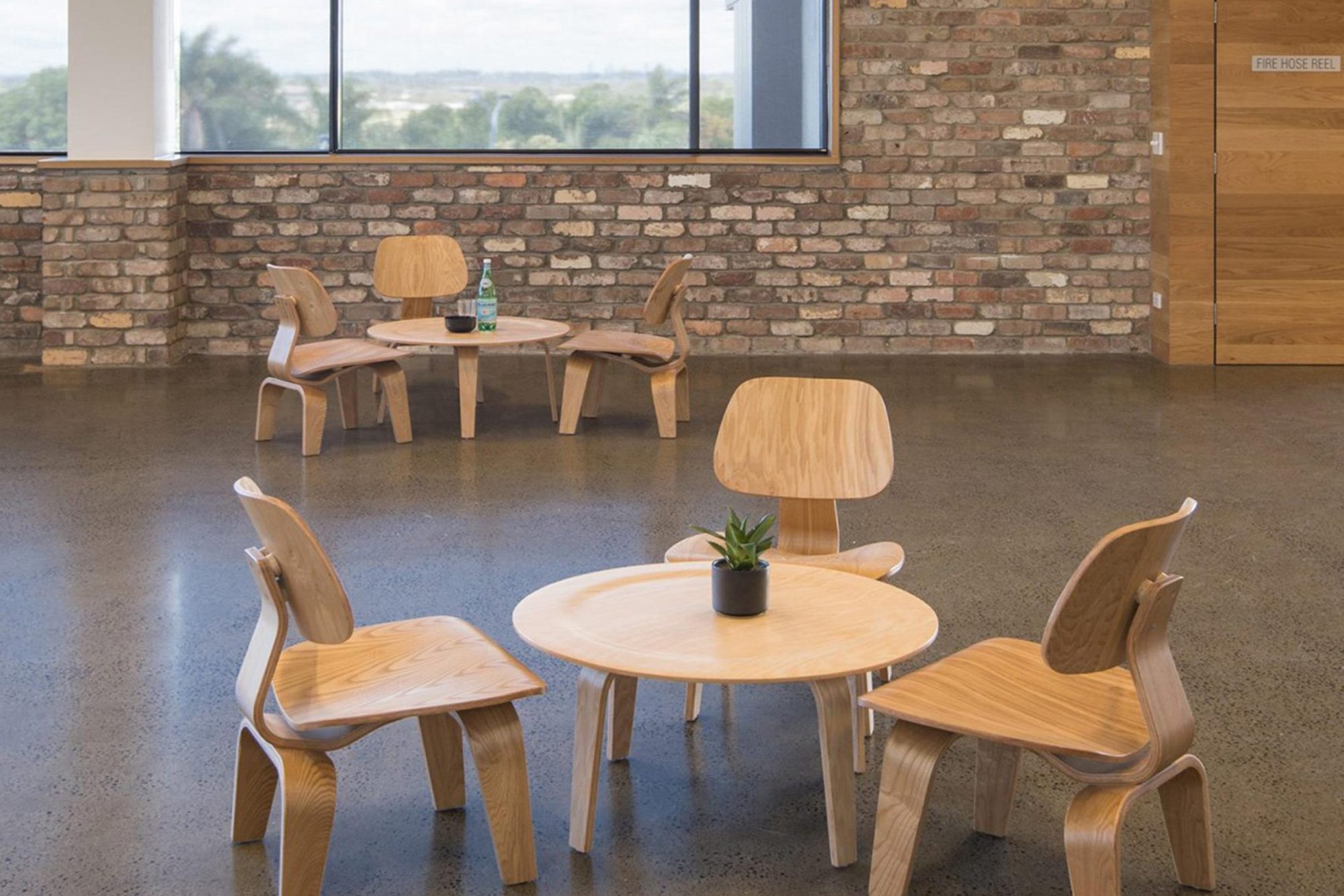 Meeting area with exposed brick and pendant lighting