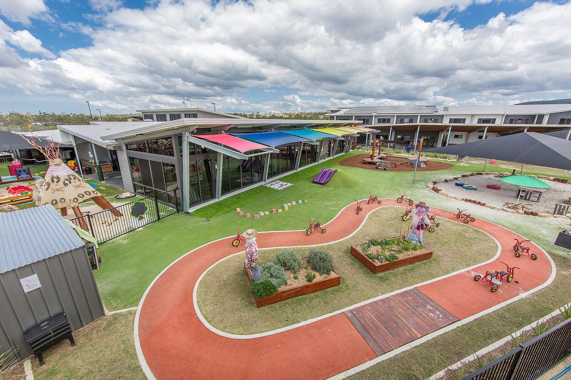 Covered play space with shade structures