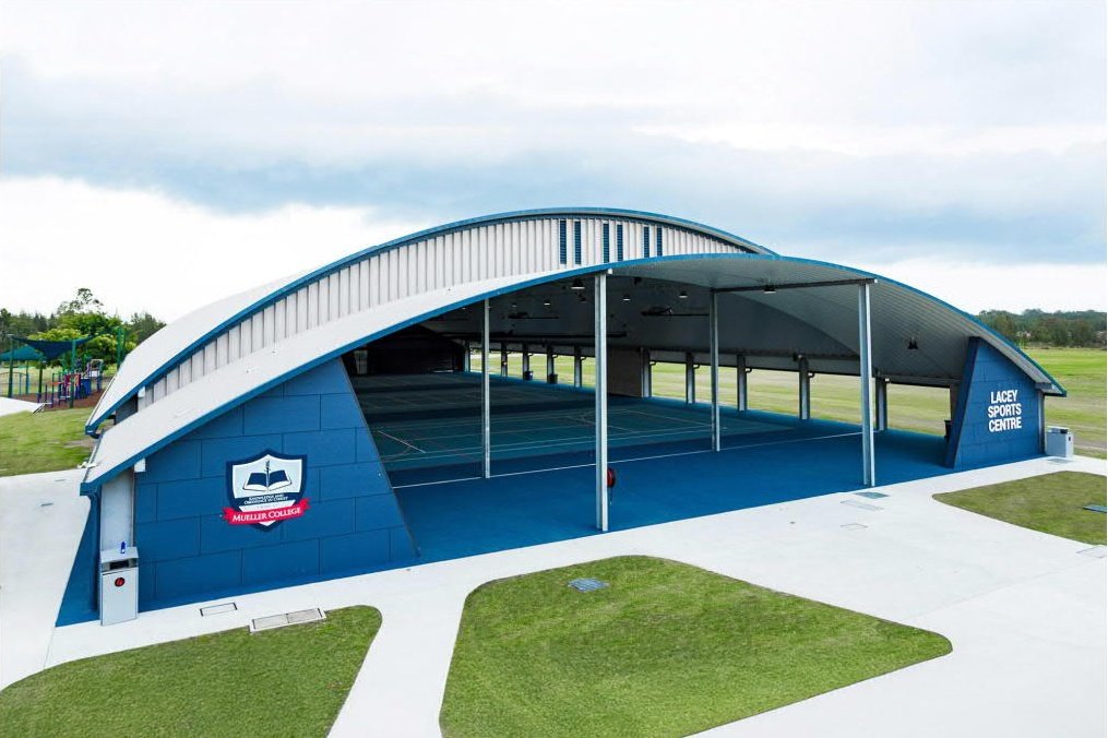 Covered sports centre with court lighting
